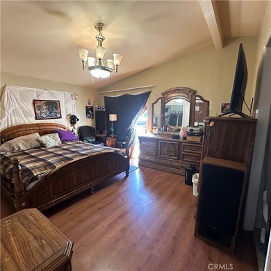 This property features a charming 3-bedroom, 2-bath manufactured - photo 17