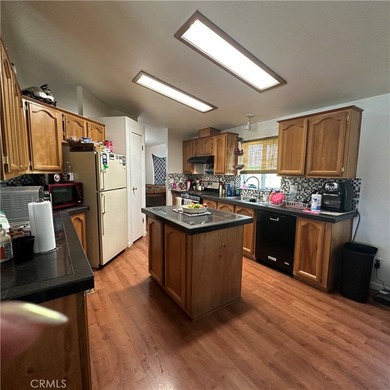 This property features a charming 3-bedroom, 2-bath manufactured - photo 23