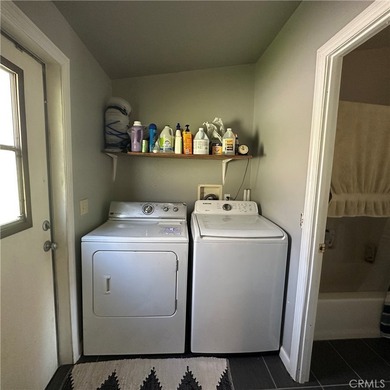 This property features a charming 3-bedroom, 2-bath manufactured - photo 24