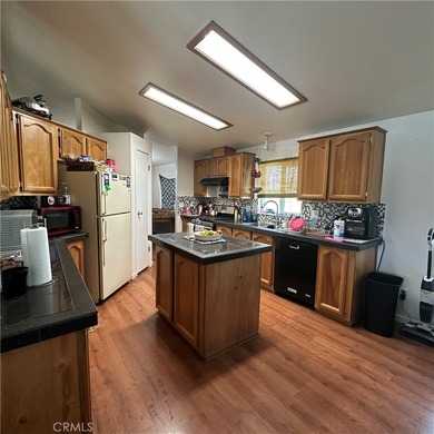 This property features a charming 3-bedroom, 2-bath manufactured - photo 30
