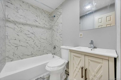 Completely renovated in 2026, with new range hood and bathroom - photo 17