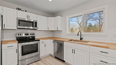 Lake view home with modern updates! This newly remodeled home - photo 9