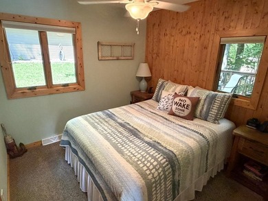 BIRD LAKE CHARMER. Tucked in the woods, this year-round home - photo 12