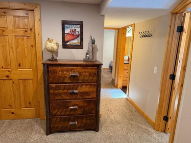BIRD LAKE CHARMER. Tucked in the woods, this year-round home - photo 15