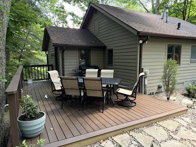 BIRD LAKE CHARMER. Tucked in the woods, this year-round home - photo 21