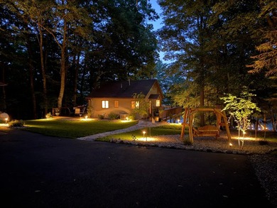 BIRD LAKE CHARMER. Tucked in the woods, this year-round home - photo 26