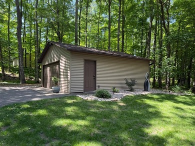 BIRD LAKE CHARMER. Tucked in the woods, this year-round home - photo 30