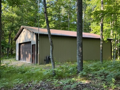 BIRD LAKE CHARMER. Tucked in the woods, this year-round home - photo 31