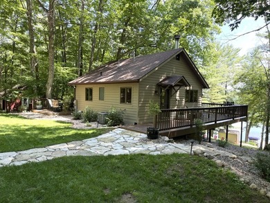 BIRD LAKE CHARMER. Tucked in the woods, this year-round home - photo 32