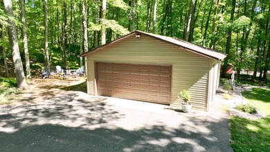 BIRD LAKE CHARMER. Tucked in the woods, this year-round home - photo 33