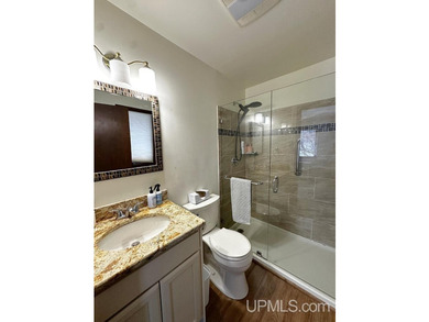 Nestled in one of Marquette's most desirable neighborhoods, this - photo 32