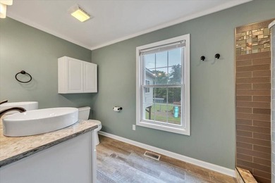 Nestled on 13.8 private acres with water frontage on beautiful - photo 13