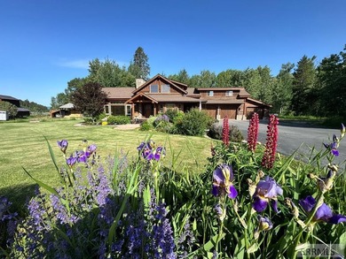 Set beneath wide-open skies with the Tetons rising in the - photo 1