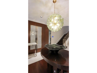 This exceptional over 20-foot-wide townhouse is discreetly - photo 6