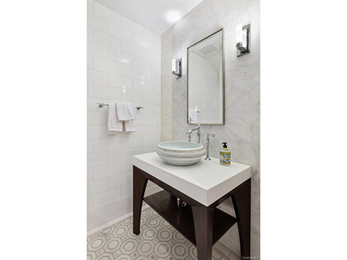 This exceptional over 20-foot-wide townhouse is discreetly - photo 9