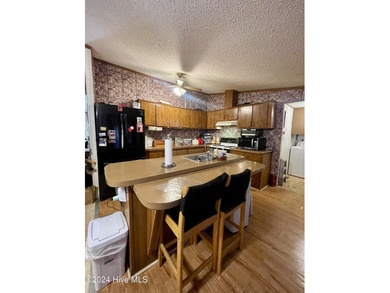 Embrace the beauty of country living with this charming