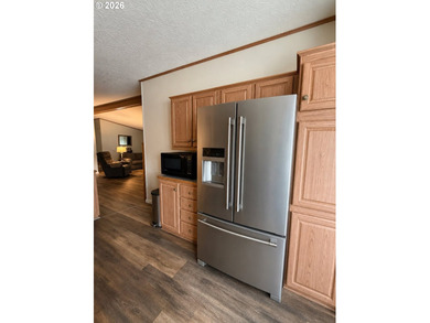 Experience tranquility at Giadanj Lake Estates with this updated - photo 12