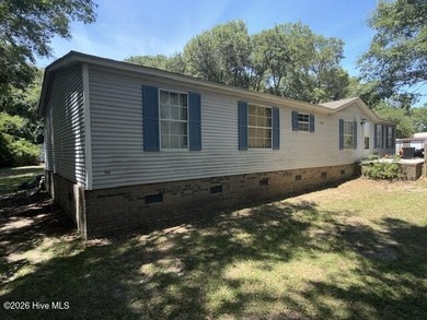 Lots of potential with this 4 bedroom 2 bathroom manufactured - photo 4