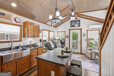 Nestled along a peaceful creek in the gated Sugar Mill Creek at - photo 12
