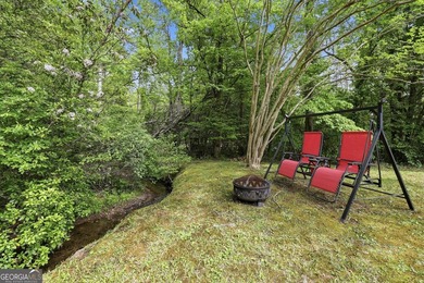 Nestled along a peaceful creek in the gated Sugar Mill Creek at - photo 23