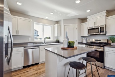 This well-designed two-story home offers an open and inviting