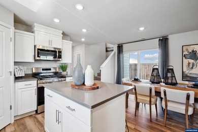 This well-designed two-story home offers an open and inviting