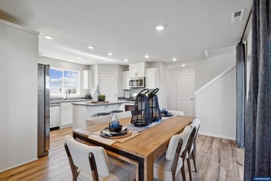 This well-designed two-story home offers an open and inviting