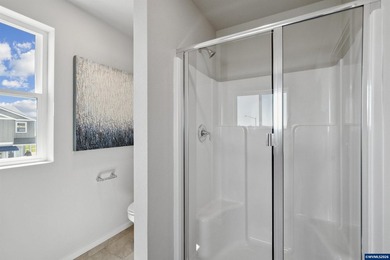 This well-designed two-story home offers an open and inviting