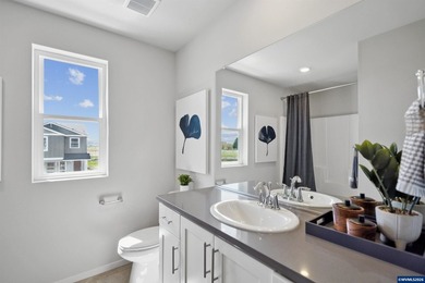 This well-designed two-story home offers an open and inviting