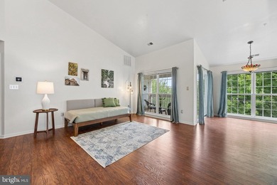 Welcome home to this beautifully maintained top-floor - photo 4
