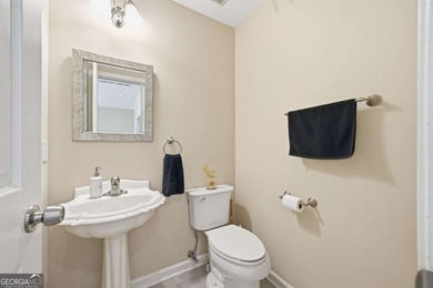 Nestled in the highly sought-after Waters Edge, this traditional - photo 11