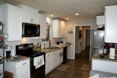 Welcome home to this beautiful, mid-century modern, 4-sided