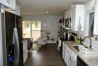 Welcome home to this beautiful, mid-century modern, 4-sided