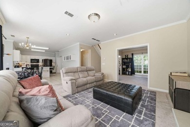 Nestled in the highly sought-after Waters Edge, this traditional - photo 15