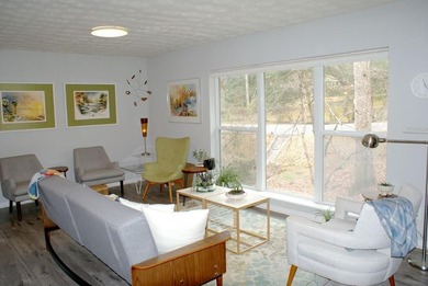 Welcome home to this beautiful, mid-century modern, 4-sided