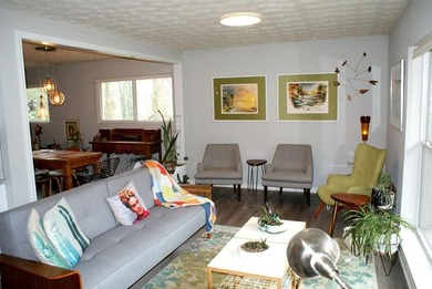 Welcome home to this beautiful, mid-century modern, 4-sided