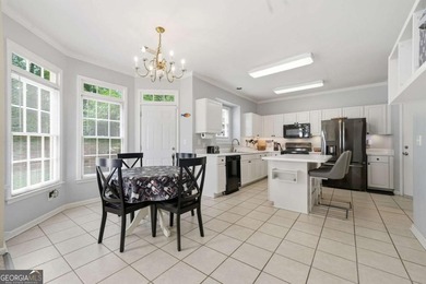 Nestled in the highly sought-after Waters Edge, this traditional - photo 17