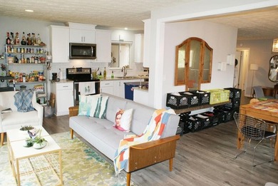 Welcome home to this beautiful, mid-century modern, 4-sided