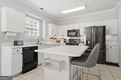 Nestled in the highly sought-after Waters Edge, this traditional - photo 18