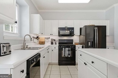 Nestled in the highly sought-after Waters Edge, this traditional - photo 19