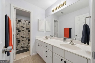 Nestled in the highly sought-after Waters Edge, this traditional - photo 27