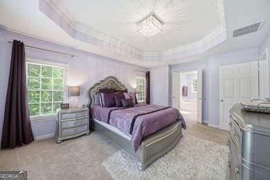 Nestled in the highly sought-after Waters Edge, this traditional - photo 32