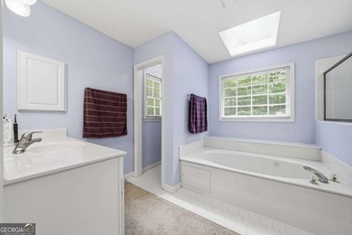 Nestled in the highly sought-after Waters Edge, this traditional - photo 35