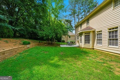 Nestled in the highly sought-after Waters Edge, this traditional - photo 39