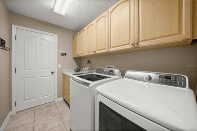 Stunning Gardenia Designer home with golf cart garage. Located - photo 31