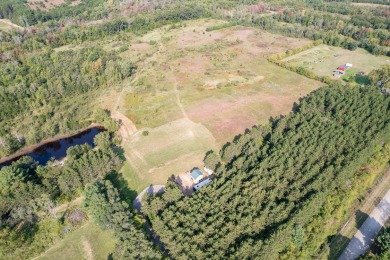 Nestled on a sprawling 50 acres, this unique retreat offers a - Lake Acreage For Sale in Necedah, Wisconsin