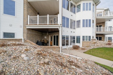 Enjoy waterfront condo living with a private patio overlooking - Lake Condo For Sale in Winneconne, Wisconsin