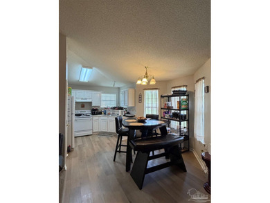 Charming **3-bedroom, 2-bath home located in the desirable - photo 4
