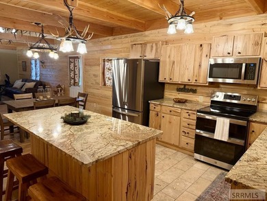 THIS HOME IS IN A HENRYS LAKE COMMUNITY WITH MARINA FOR USE BY - photo 3