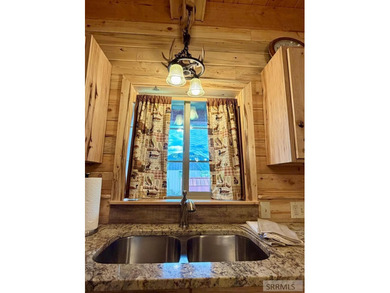 THIS HOME IS IN A HENRYS LAKE COMMUNITY WITH MARINA FOR USE BY - photo 7